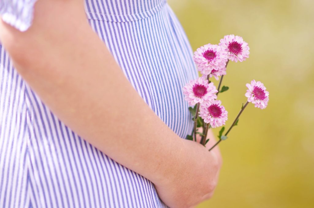 a person holding a flower